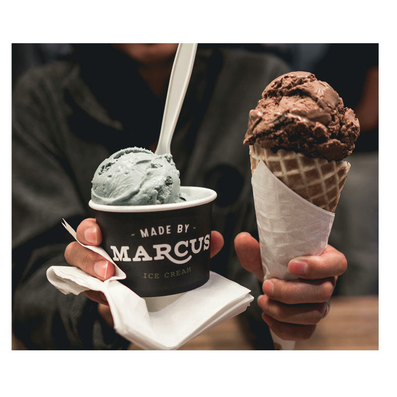 Buying an Ice Cream Truck with a hand holding a cup of mint ice cream and another hand holding a cone of chocolate ice cream.