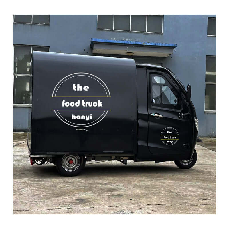 Mobile Coffee Shop on Wheels electric tricycle parked outside a building with unique branding.