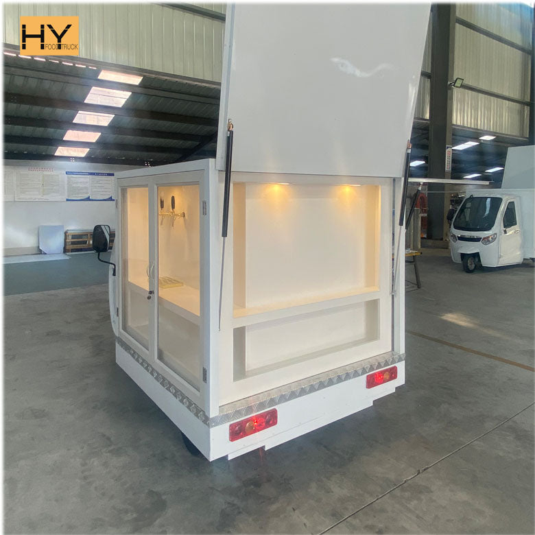 Wedding Bar Mobile Tricycle in a bright interior with ample shelving for serving drinks.