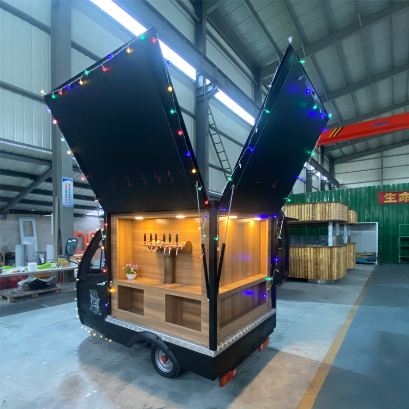 Wedding Bartender mobile beer bar featuring vintage teak tricycle cart with colorful lights in an open position.