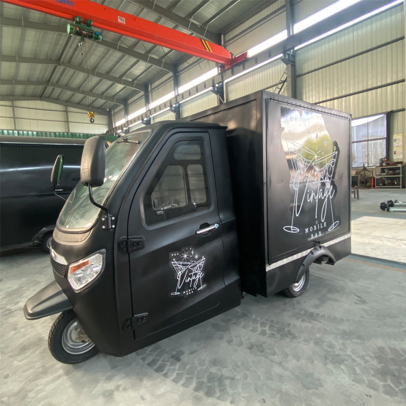 Wedding Bartender mobile beer bar vintage teak tricycle cart showcased in a spacious indoor space.