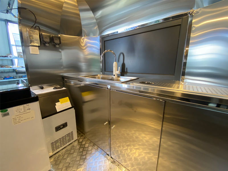 Food Trailer Airstream interior with high-grade stainless steel kitchen and modern fixtures.